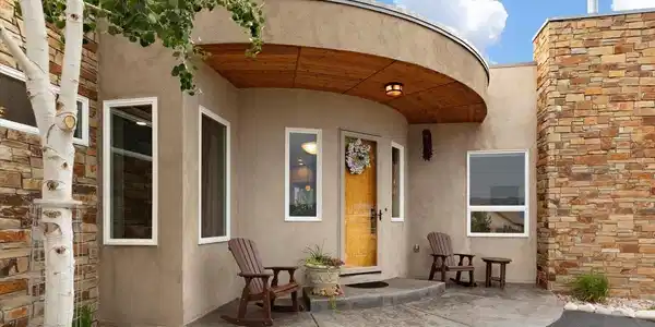 Image 3: Welcoming entry with rock accents