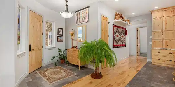 Image 4: Entry opens up to the high ceilings throughout