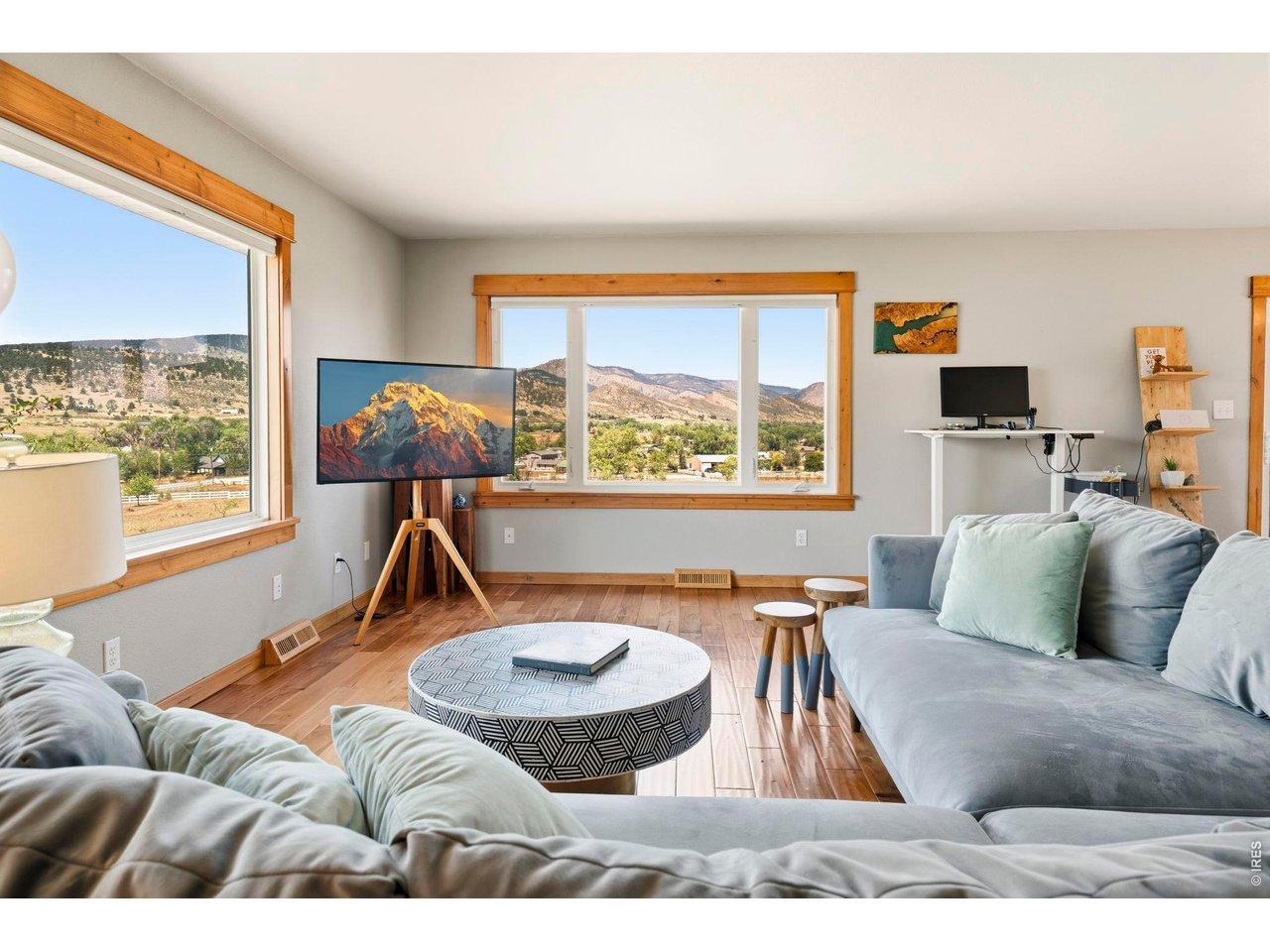 Image 3: The living room offers large picture windows to watch sunsets, wildlife and unobstructed views. Image 3: The living room offers large picture windows to watch sunsets, wildlife and unobstructed views.