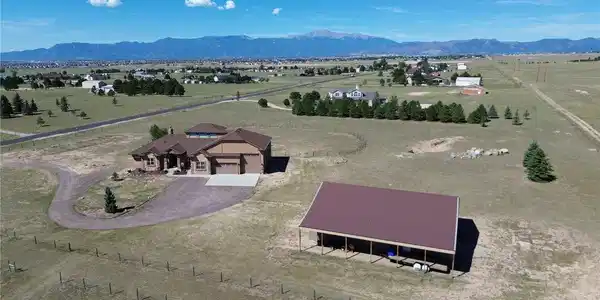 Image 3: 5 fully fenced acres with a pole barn that offers a pull-thru RV option or workshop Image 3: 5 fully fenced acres with a pole barn that offers a pull-thru RV option or workshop