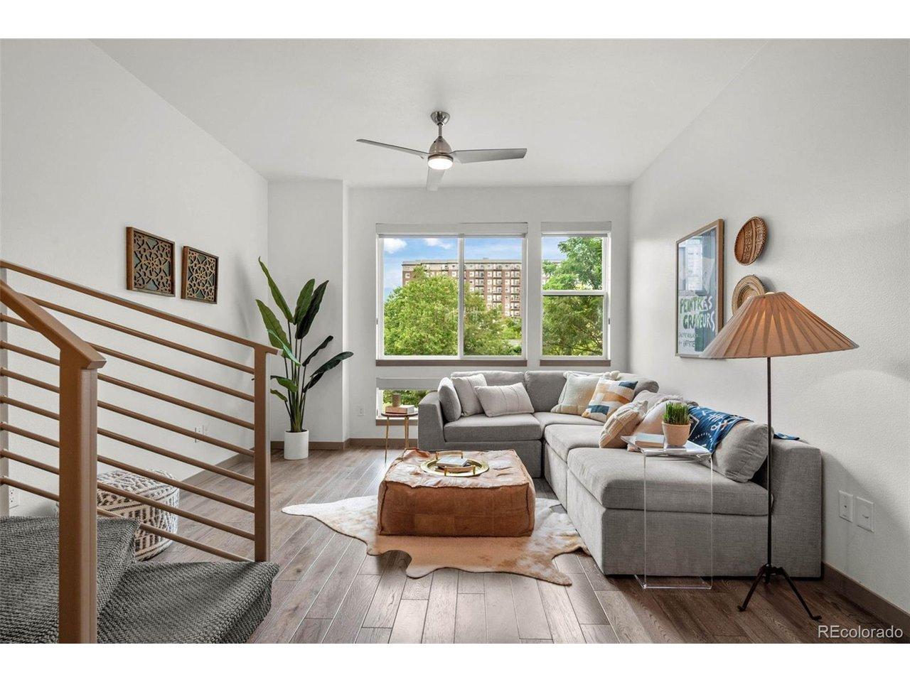 Image 1: Living room with extra tall ceilings and lots of natural light. Image 1: Living room with extra tall ceilings and lots of natural light.