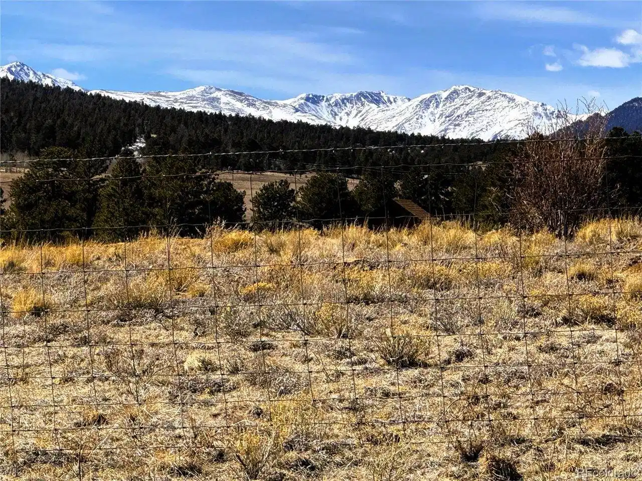Image 1: Zoomed view southwest from the property to the snow capped Collegiate Peaks
