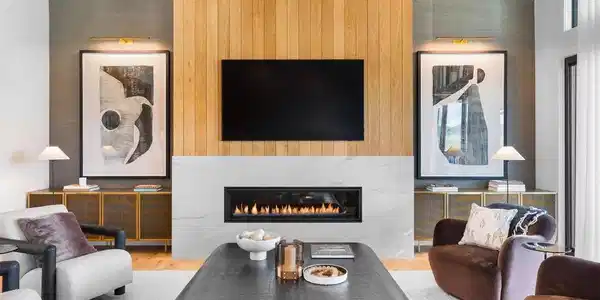 Image 2: White oak and marble fireplace surround creating a refined focal point.