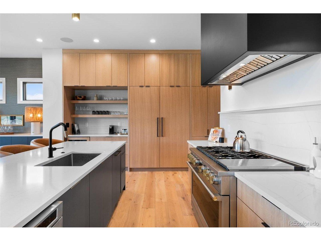 Image 4: Monogram range framed by white oak cabinetry and clean-lined finishes. Image 4: Monogram range framed by white oak cabinetry and clean-lined finishes.