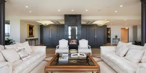 Image 4: Custom linear gas fireplace seamlessly blends the entryway to the living room. Image 4: Custom linear gas fireplace seamlessly blends the entryway to the living room.