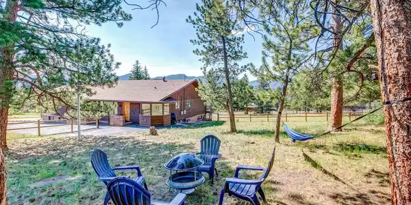 Image 3: Inviting outdoor gathering space surrounded by mature pines, offering a peaceful setting to relax, entertain and enjoy Colorado mountain living. Image 3: Inviting outdoor gathering space surrounded by mature pines, offering a peaceful setting to relax, entertain and enjoy Colorado mountain living.