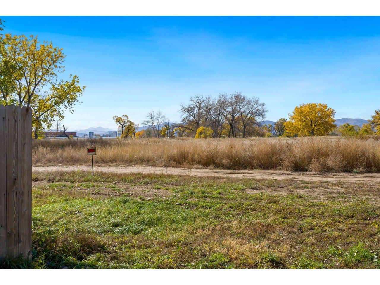 Image 1: View from back of lot facing open space Image 1: View from back of lot facing open space