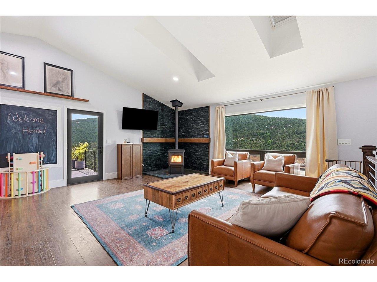 Image 2: Woodburning fireplace creates the perfect mountain ambiance Image 2: Woodburning fireplace creates the perfect mountain ambiance