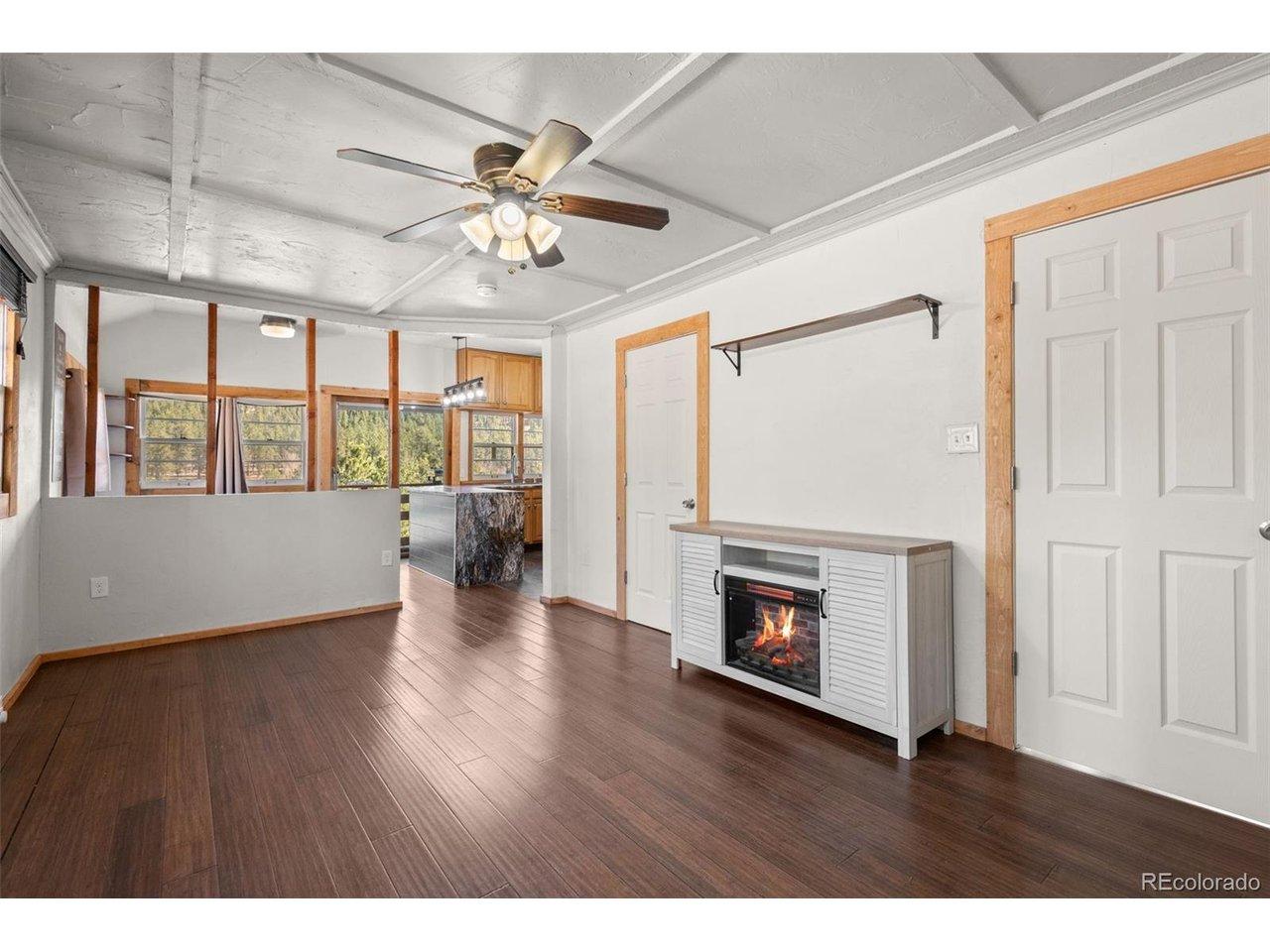 Image 4: Entry into living room! You can see through the dining room and kitchen out to the gorgeous meadow! Image 4: Entry into living room! You can see through the dining room and kitchen out to the gorgeous meadow!