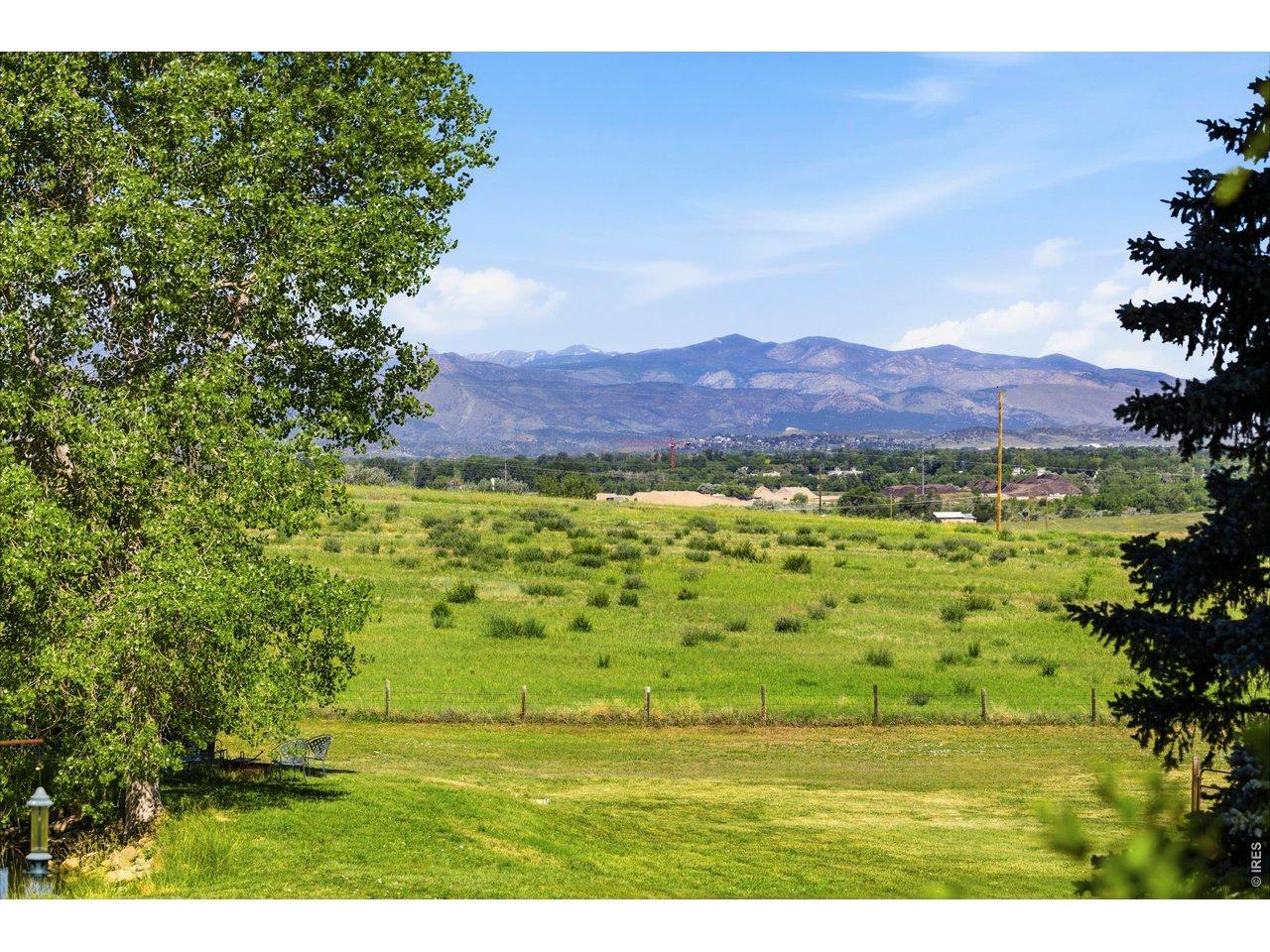 Image 2: Longs Peak and snow-capped mountain views provide stunning backdrop for this exceptional property!