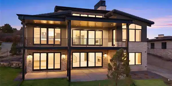 Image 2: Striking modern architecture meets effortless indoor-outdoor living, with expansive glass, covered terraces, and warm evening ambiance creating an inviting retreat. Image 2: Striking modern architecture meets effortless indoor-outdoor living, with expansive glass, covered terraces, and warm evening ambiance creating an inviting retreat.