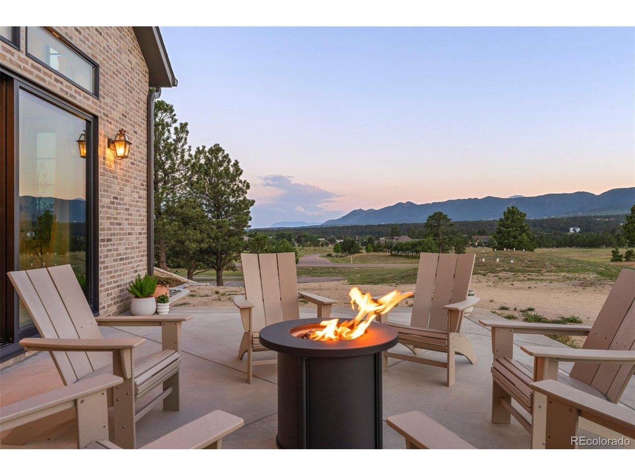 Image 4: Outdoor fire pit with breathtaking mountain views, perfect for relaxing evenings. Image 4: Outdoor fire pit with breathtaking mountain views, perfect for relaxing evenings.