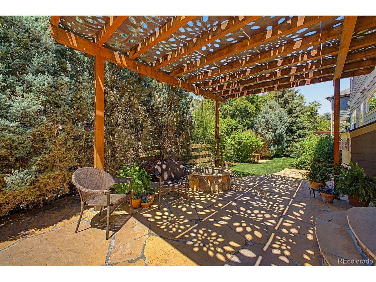 Image 4: Backyard flagstone patio with gas firepit and mature landscaping Image 4: Backyard flagstone patio with gas firepit and mature landscaping