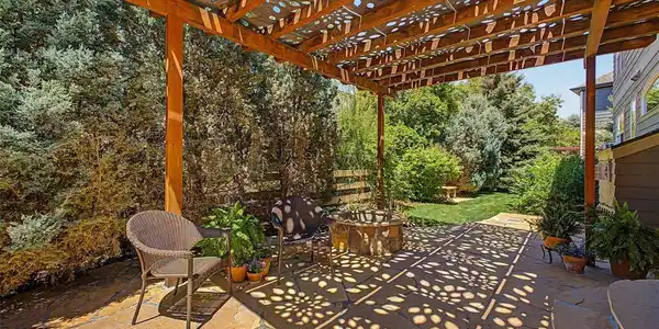 Image 4: Backyard flagstone patio with gas firepit and mature landscaping Image 4: Backyard flagstone patio with gas firepit and mature landscaping
