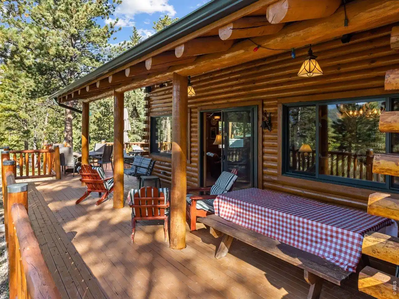 Image 1: The deck wraps two sides of the house, perfect for large gatherings. Image 1: The deck wraps two sides of the house, perfect for large gatherings.
