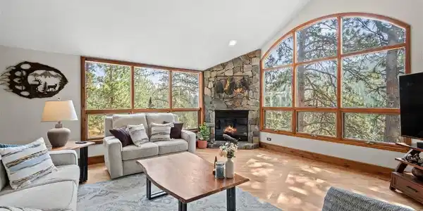 Image 4: Soaring vaulted ceilings and walls of glass fill the great room with natural light Image 4: Soaring vaulted ceilings and walls of glass fill the great room with natural light