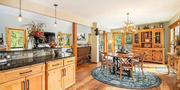 Image 4: Kitchen opens seamlessly to dining and living spaces