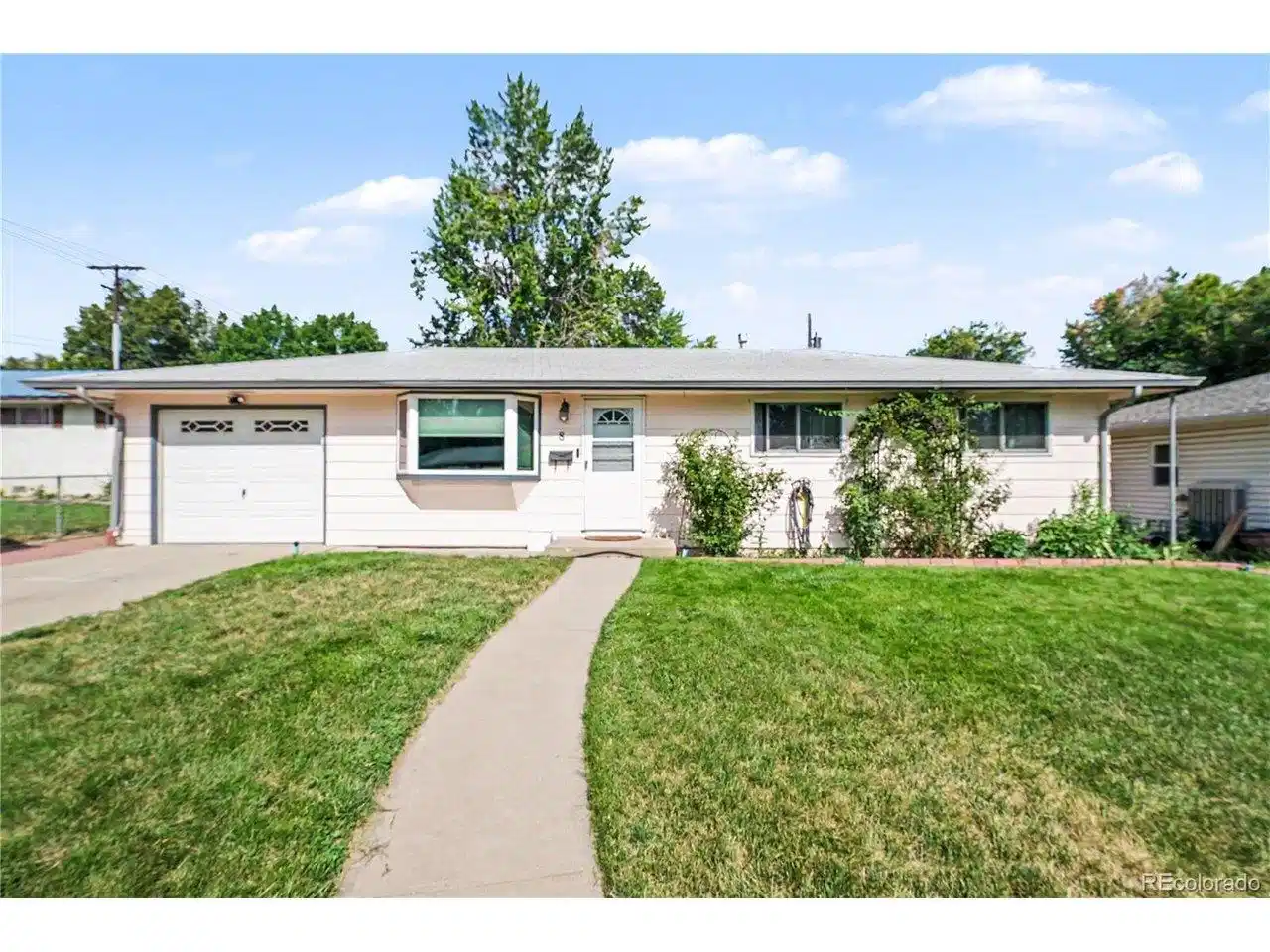 Image 1: Exterior front with walkway & front lawn