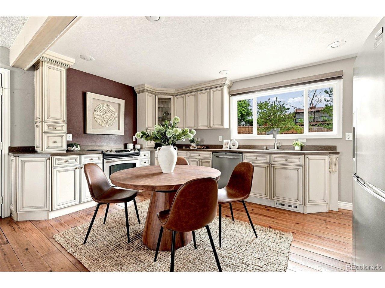 Image 3: updated kitchen with views of the backyard