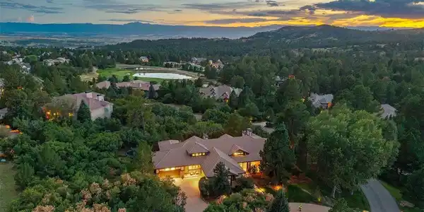 Image 2: Sweeping mountain views provide a stunning backdrop for this extraordinary 4 Bedroom | 7 bathroom residence in the heart of The Village at Castle Pines. Image 2: Sweeping mountain views provide a stunning backdrop for this extraordinary 4 Bedroom | 7 bathroom residence in the heart of The Village at Castle Pines.
