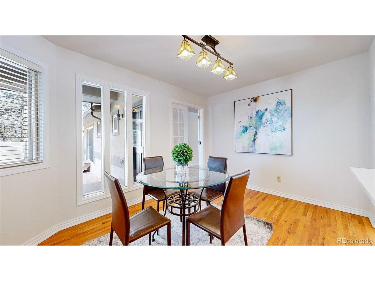 Image 4: Formal dining space with natural hardwoods and open to the kitchen Image 4: Formal dining space with natural hardwoods and open to the kitchen