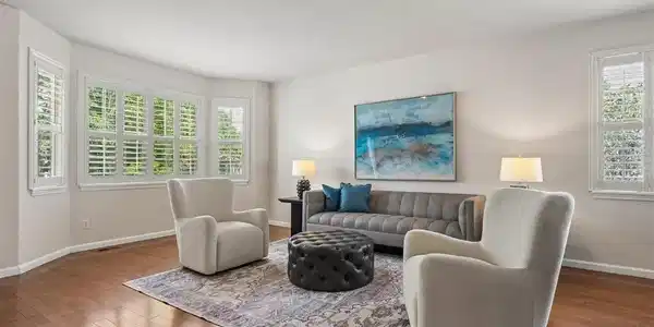 Image 4: Spacious entry introduces the home's open layout and warm hardwood flooring. Image 4: Spacious entry introduces the home's open layout and warm hardwood flooring.