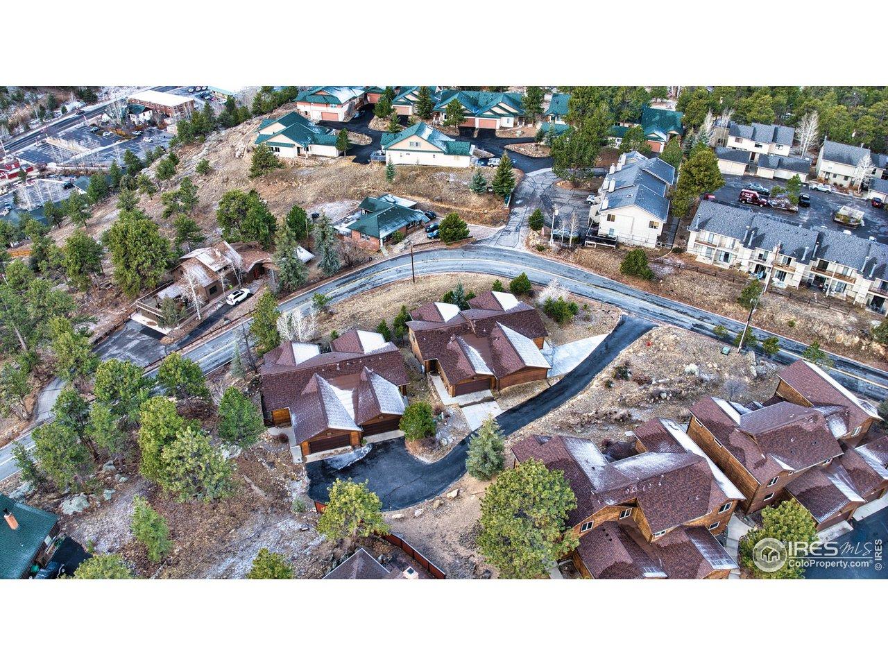 Image 3: Bird's eye view showcasing the thoughtful layout of these mountain townhomes with generous lot sizes, private outdoor spaces, and native landscaping. Just a few minutes walk into Downtown Estes Park. Image 3: Bird's eye view showcasing the thoughtful layout of these mountain townhomes with generous lot sizes, private outdoor spaces, and native landscaping. Just a few minutes walk into Downtown Estes Park.