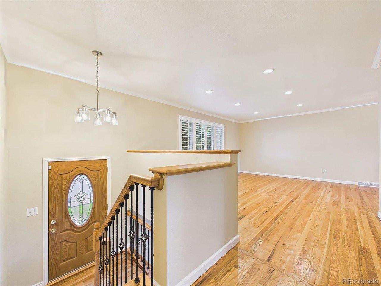 Image 3: Entry & Living Room - Bright, inviting entry opens to the main living area, showcasing freshly refinished hardwood floors, fresh interior paint, and an open, airy layout. Image 3: Entry & Living Room - Bright, inviting entry opens to the main living area, showcasing freshly refinished hardwood floors, fresh interior paint, and an open, airy layout.