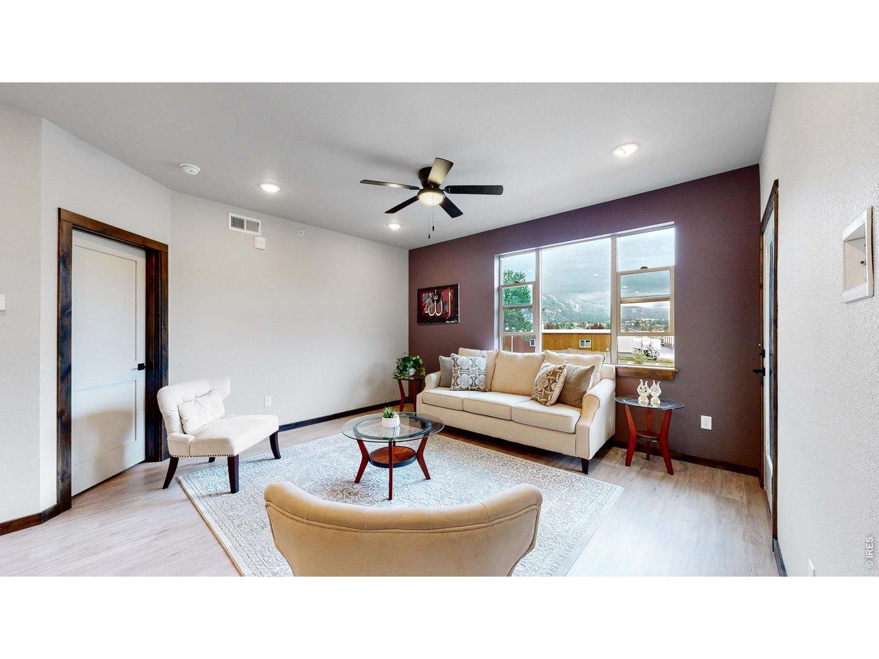Image 1: Comfortable living spaces with great view of Lumpy Ridge.