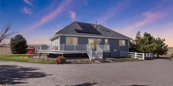 Image 2: Back of the home, beautiful wrap around deck to enjoy the views! Image 2: Back of the home, beautiful wrap around deck to enjoy the views!