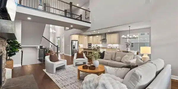 Image 3: The grand two-story great room features soaring ceilings, dramatic natural light, and an elegant sense of scale. Image 3: The grand two-story great room features soaring ceilings, dramatic natural light, and an elegant sense of scale.