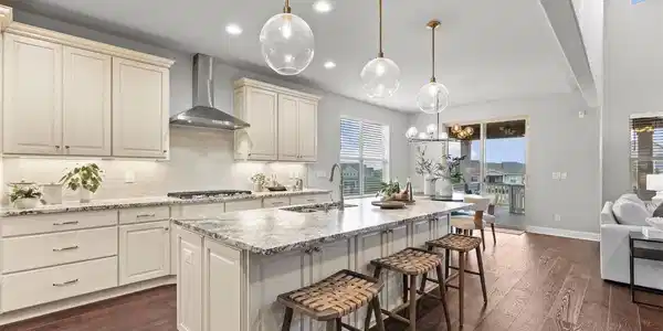 Image 4: The beautifully appointed kitchen boasts leathered granite, upgraded cabinetry, stainless appliances, and walk-in pantry. Image 4: The beautifully appointed kitchen boasts leathered granite, upgraded cabinetry, stainless appliances, and walk-in pantry.