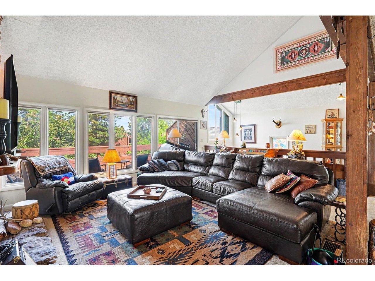 Image 3: Vaulted living room with soaring ceilings and abundant natural light Image 3: Vaulted living room with soaring ceilings and abundant natural light