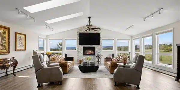 Image 3: The raised ranch layout places all principal living areas - kitchen, dining, great room, and primary suite - on the upper level, where the views are most commanding. Image 3: The raised ranch layout places all principal living areas - kitchen, dining, great room, and primary suite - on the upper level, where the views are most commanding.