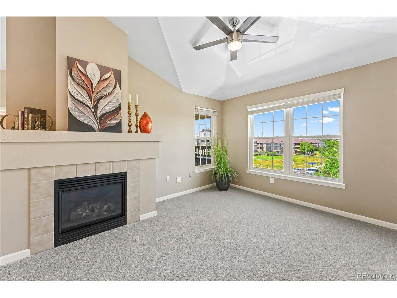 Image 2: Living room with Vaulted Ceilings, Gas Fireplace, Ceiling Fan