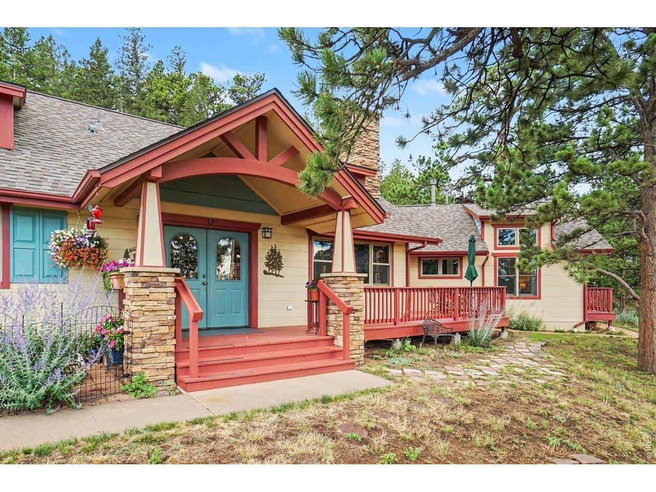 Image 3: The home is accented with stone pillars and low-maintenance fiber-cement siding and cedar trim Image 3: The home is accented with stone pillars and low-maintenance fiber-cement siding and cedar trim