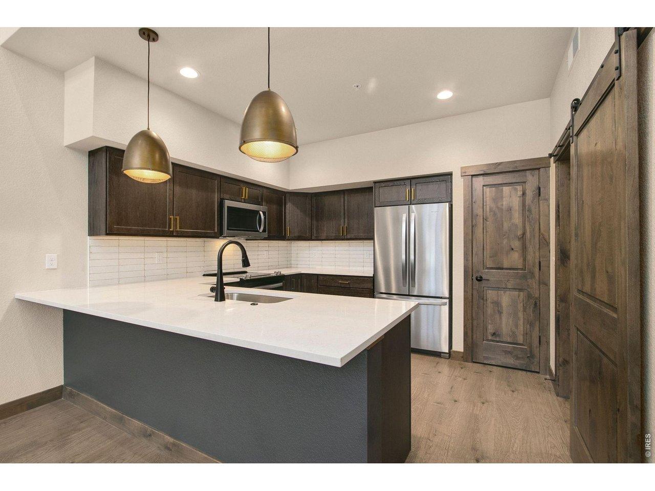 Image 4: Quartz countertops and stainless appliances Image 4: Quartz countertops and stainless appliances