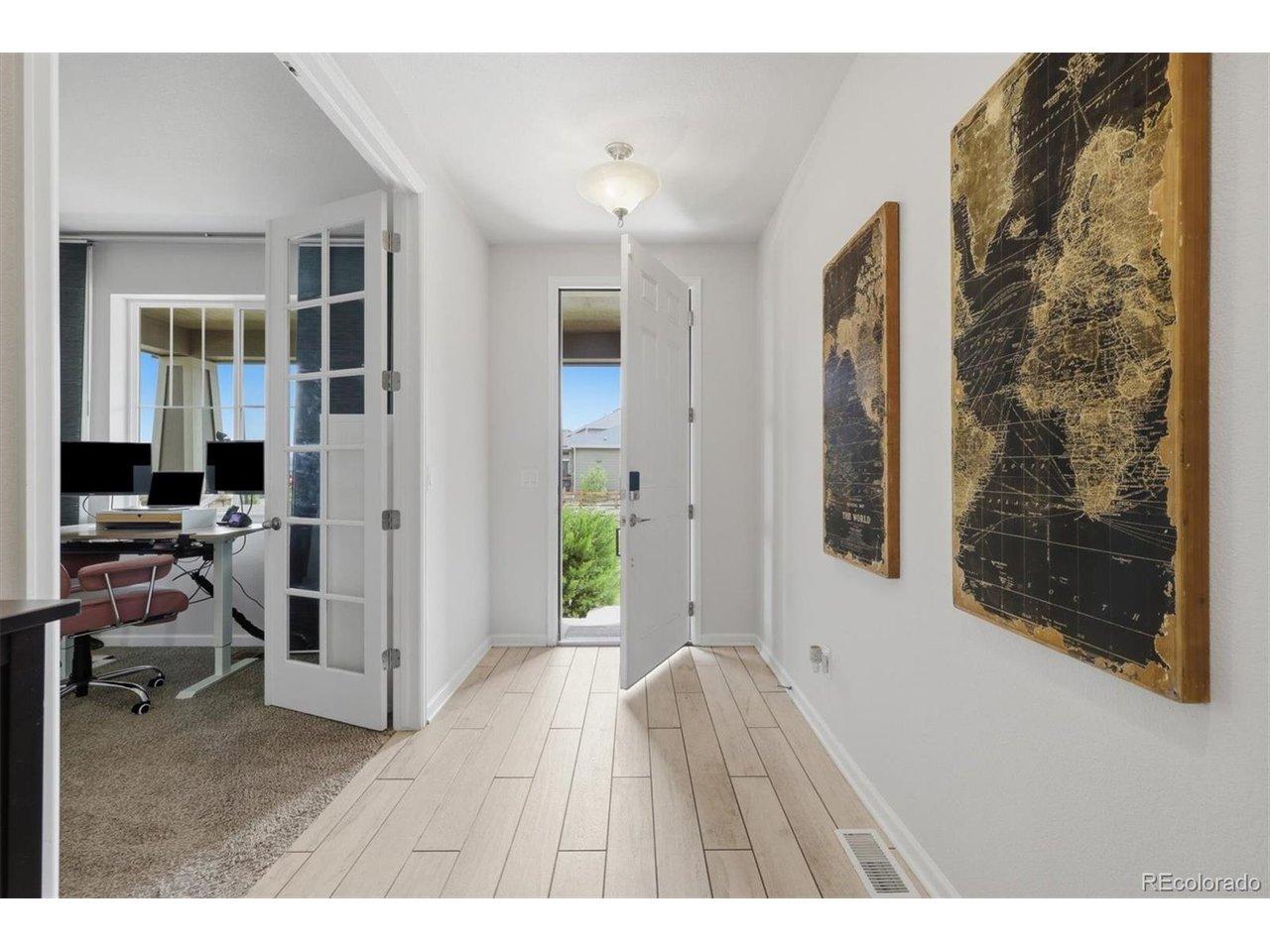 Image 3: Spacious foyer with wide hallway and office located in front of home. Image 3: Spacious foyer with wide hallway and office located in front of home.