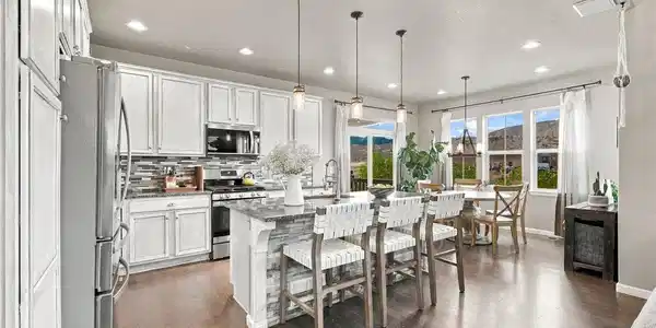 Image 3: A polished kitchen with granite countertops, crisp cabinetry & elevated details, from the finishes to the statement lighting. Image 3: A polished kitchen with granite countertops, crisp cabinetry & elevated details, from the finishes to the statement lighting.