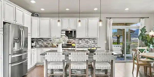 Image 4: The kitchen island is perfect for morning coffee or swanky cocktail hour. Image 4: The kitchen island is perfect for morning coffee or swanky cocktail hour.