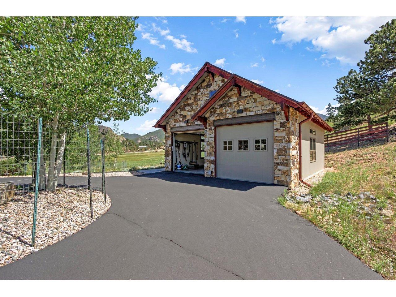 Image 3: The detached garage built in 2020 by Kinley Built combines elegance with exceptional functionality for vehicles, recreation, and storage. Both the attached and detached garages have Epoxy-coated floors. Image 3: The detached garage built in 2020 by Kinley Built combines elegance with exceptional functionality for vehicles, recreation, and storage. Both the attached and detached garages have Epoxy-coated floors.