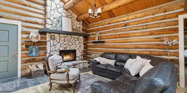 Image 2: Come gather around the floor to ceiling stone wood burning fireplace Image 2: Come gather around the floor to ceiling stone wood burning fireplace