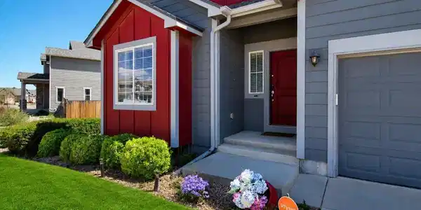 Image 2: Contemporary exterior featuring gray horizontal siding and red vertical siding accents Image 2: Contemporary exterior featuring gray horizontal siding and red vertical siding accents