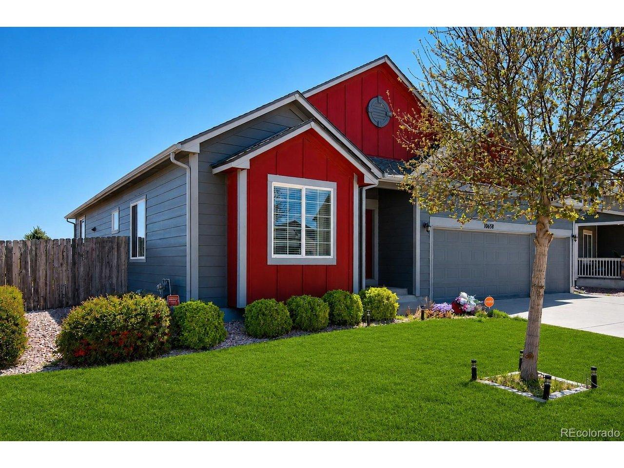 Image 3: Modern ranch-style home featuring striking red and gray siding Image 3: Modern ranch-style home featuring striking red and gray siding
