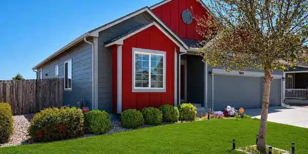 Image 3: Modern ranch-style home featuring striking red and gray siding Image 3: Modern ranch-style home featuring striking red and gray siding