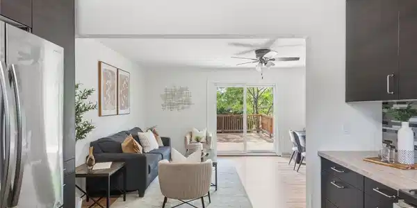 Image 2: Open sightlines from the kitchen to the living room and deck beyond. The layout flows easily for everyday living and entertaining. Image 2: Open sightlines from the kitchen to the living room and deck beyond. The layout flows easily for everyday living and entertaining.