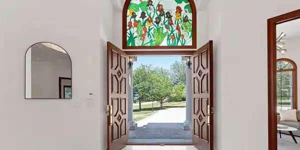 Image 3: Grand entry with double doors and custom stained glass
