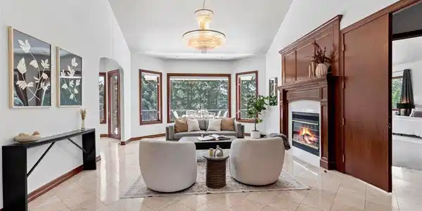 Image 4: Inviting living room with marble tiles, fireplace and Italian chandelier