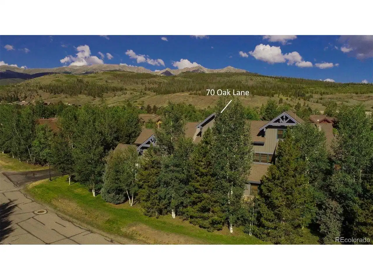Image 1: Ten Mile Mountain Range Views from the great room, primary bedroom suite and front decks of this Highland Greens Townhome.  The backyard backs to open space.