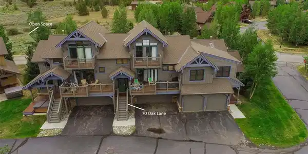 Image 2: Ten Mile Mountain Range Views from the great room, primary bedroom suite and front decks of this Highland Greens Townhome.  The backyard backs to open space.